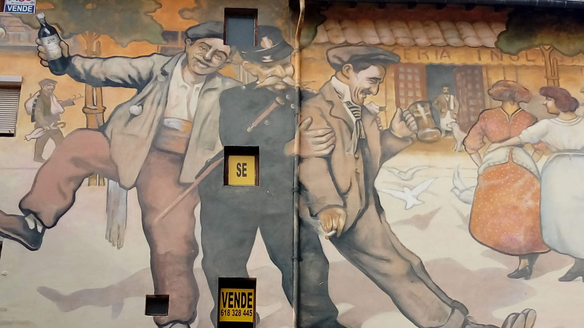 Wandgemälde in Haro, Rioja, mit betrunkenen Männern